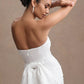 STRAPLESS PEARL BACK BOW DRESS